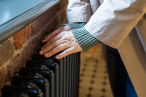 Warming hands on radiator